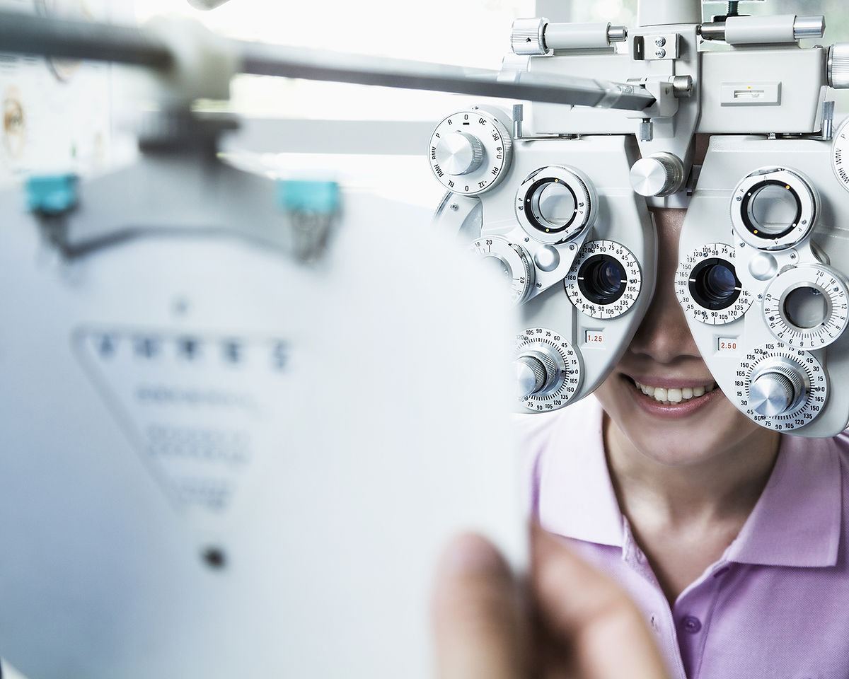 Patient behind a phoropter