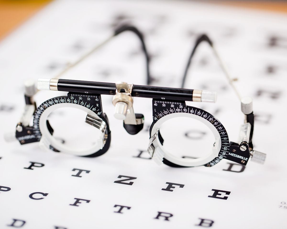 Trial frame resting on an eye chart